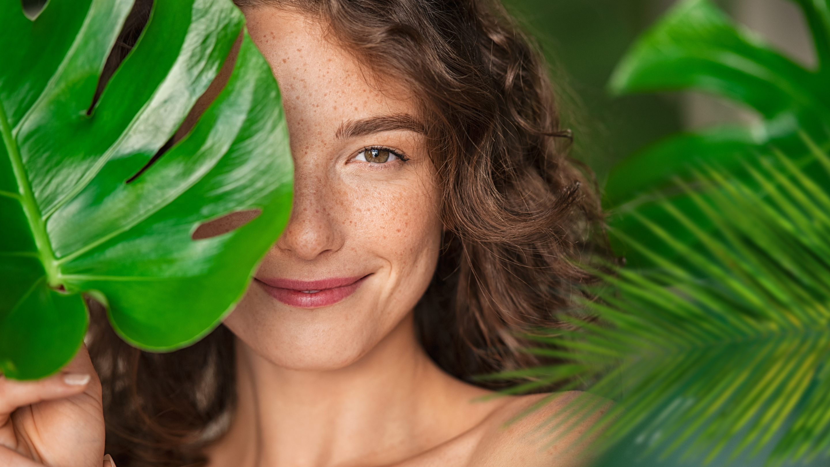 a woman holding a leaf